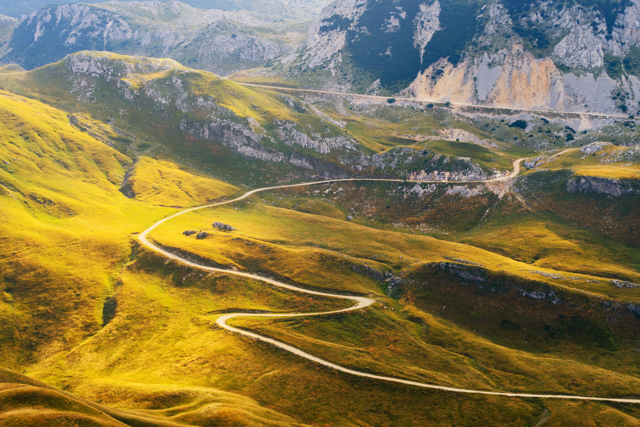 winding-mountain-road-in-alps